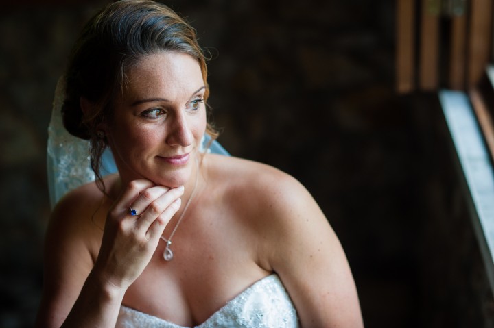 Bride poses for a moment before her ceremony at Gaither Chapel