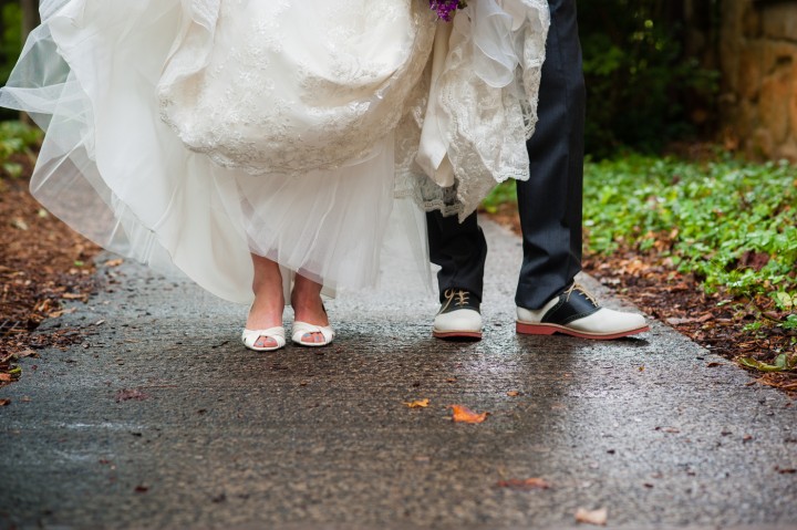 Bride and groom show off their shoes