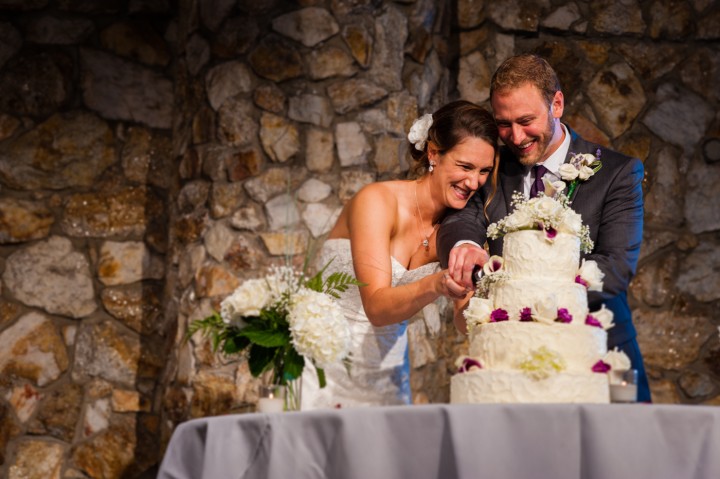 Bride and groom cut the cake at their montreat wedding reception