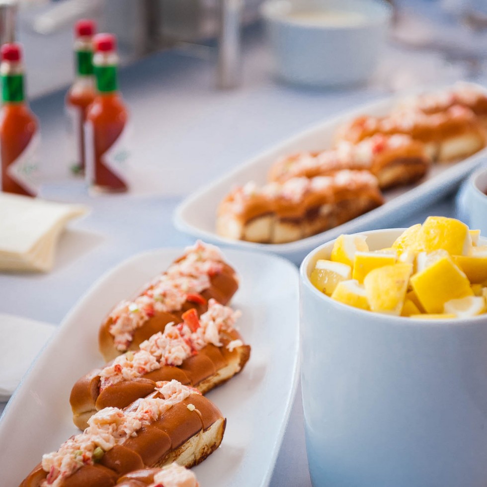 Plates of Lobster Rolls and Dishes of Lemon Wedges at a New Hapmshire Tented Wedding