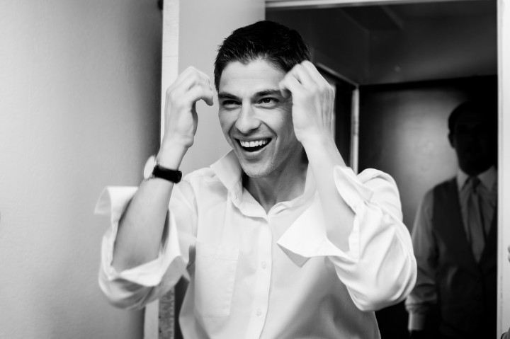 groom fixing his hair before the ceremony