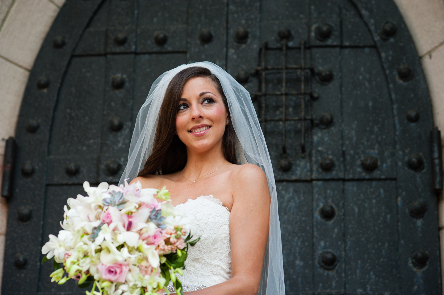 Bride with her gorgeous bouquet poses for a quick portrait