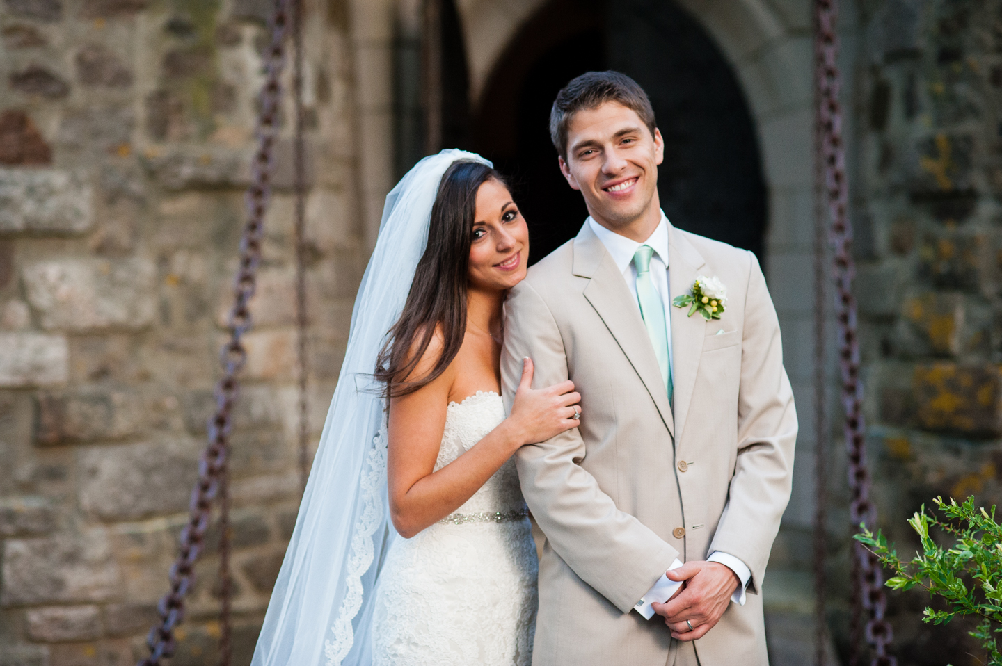 gorgeous bride and groom pose for a quick portrait after their wedding ceremony at hammond castle