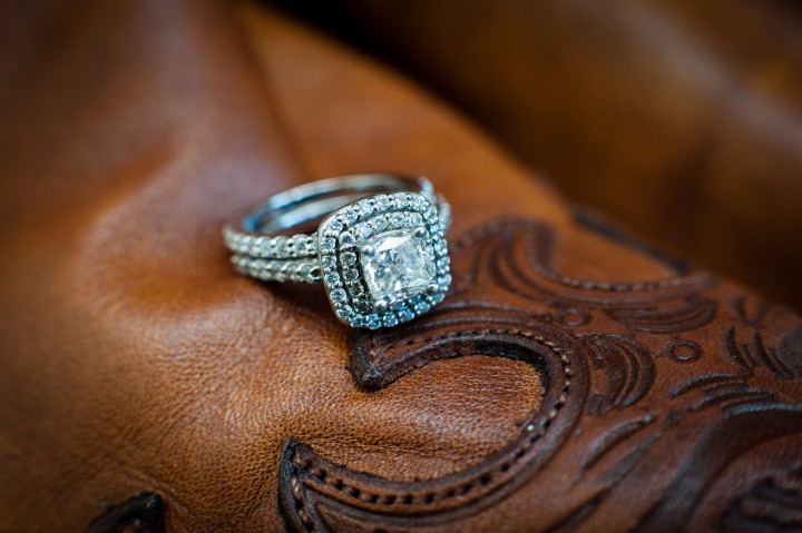 beautiful engagement ring on top of brides cowboy boot