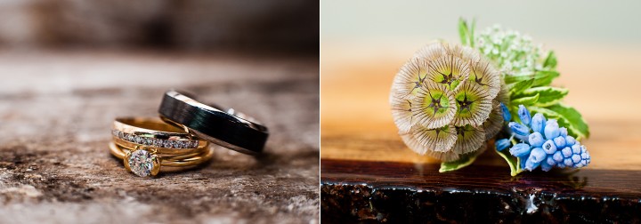 Wedding rings rest on beautiful barn wood and delicate purple and green boutonnière about to be put on groom