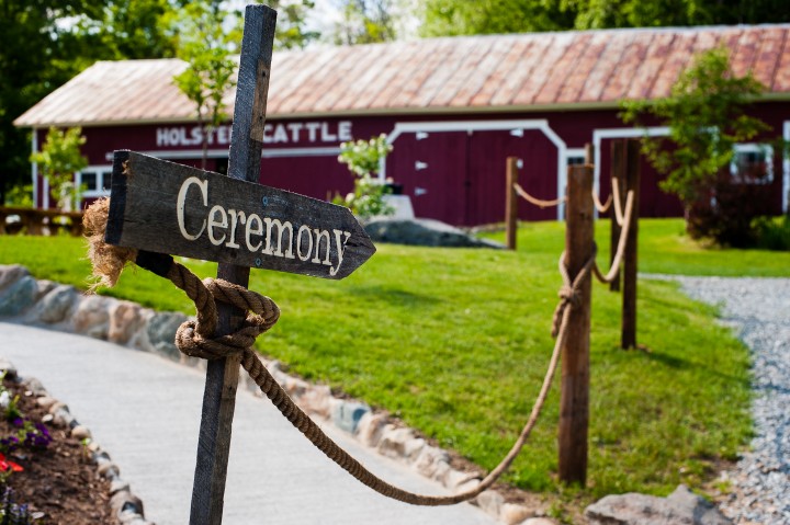 Handmade wooden ceremony sign directs guests where to go 