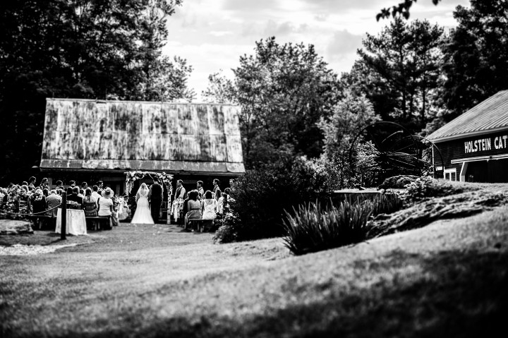 black and white image of a rustic outdoor ceremony 