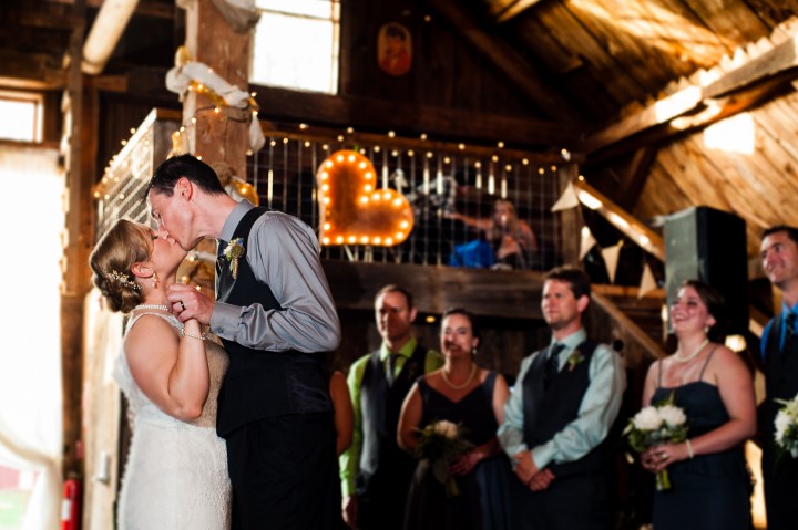 bride and groom kiss after their first dance 