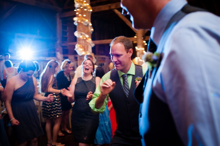 guests dancing during a wedding reception in the barn 