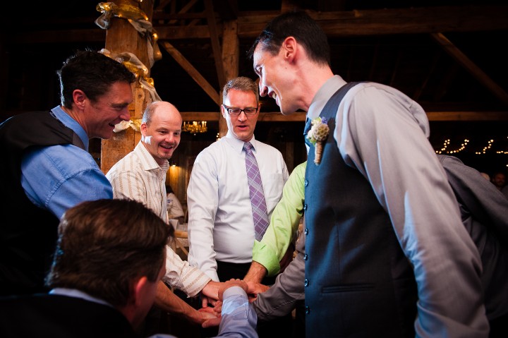 groom and his guys give each other low fives