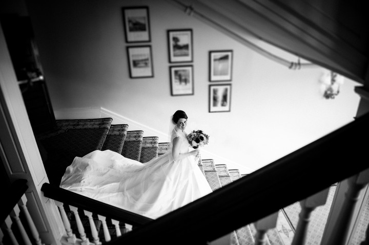 black and white image of gorgeous bride on the Omni Mt. Washington staircase 