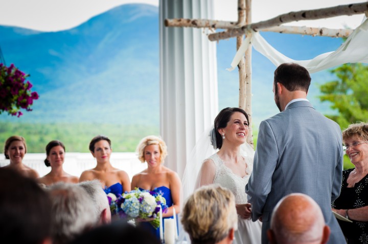 Bride smiles up at handsome groom during their Omni Mount Washington Wedding