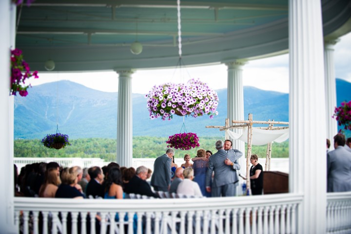 bride and groom hugging the grooms parents during their gorgeous mountain ceremony