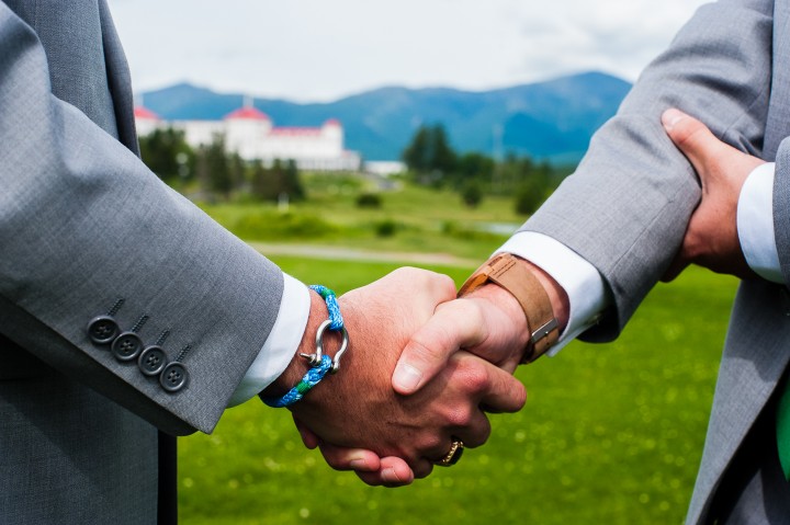 the groom and his best man shaking hands