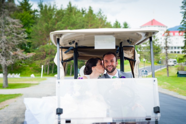 the bride and groom driving a golf cart for some fun couples wedding day portraits