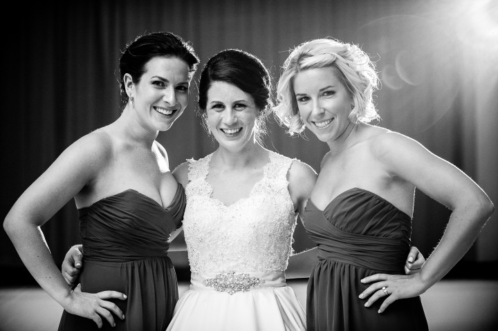 beautiful bride and her two maids of honor pose for a quick portrait