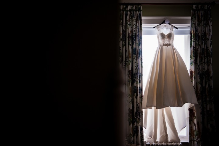 Gorgeous Stella York Wedding gown hangs in the window of the Omni Mount Washington Hotel