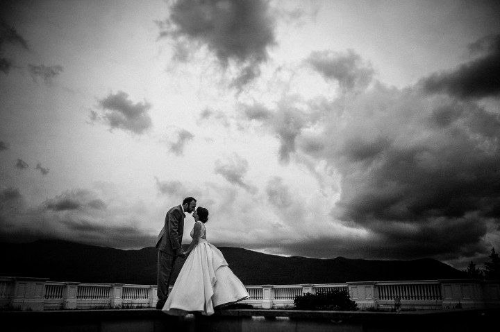 the bride and groom kiss during their mountain wedding portraits