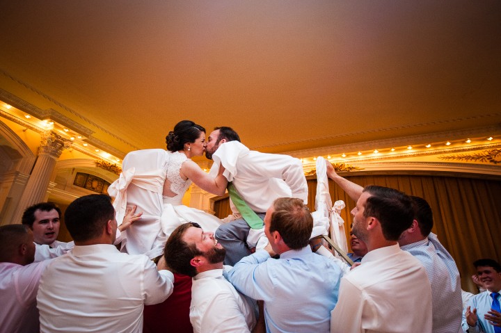 the bride and groom have a blast during a crowd favorite during any reception, the hora