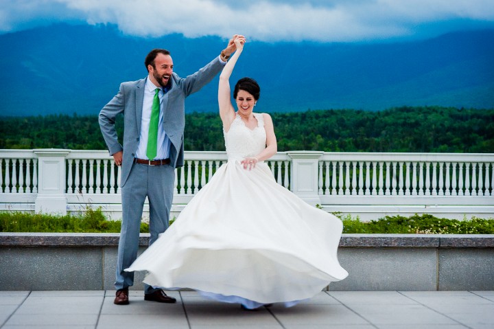 bride and groom showing off their dance moves on the terrance of the stunning mount washington hotel