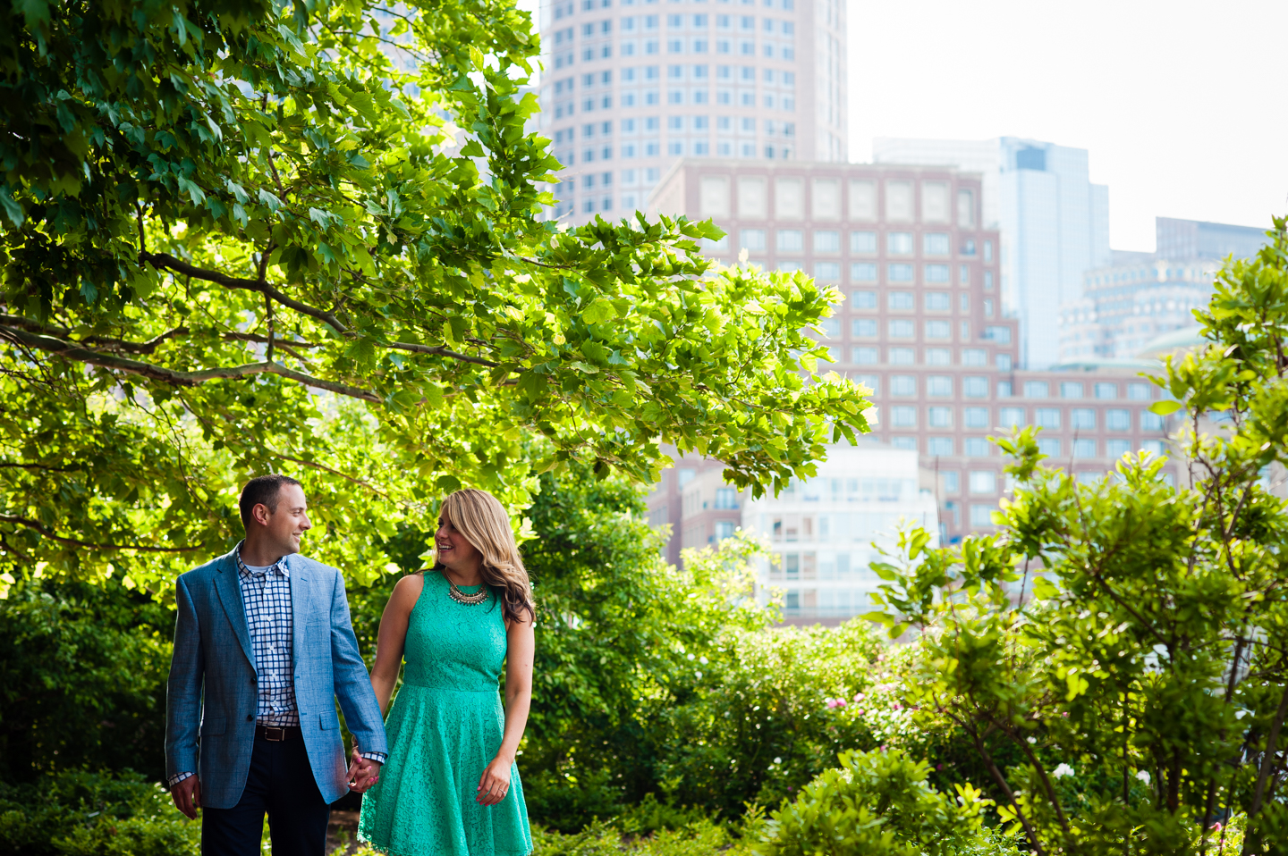 Couple talks to each other under gorgeous shady trees 