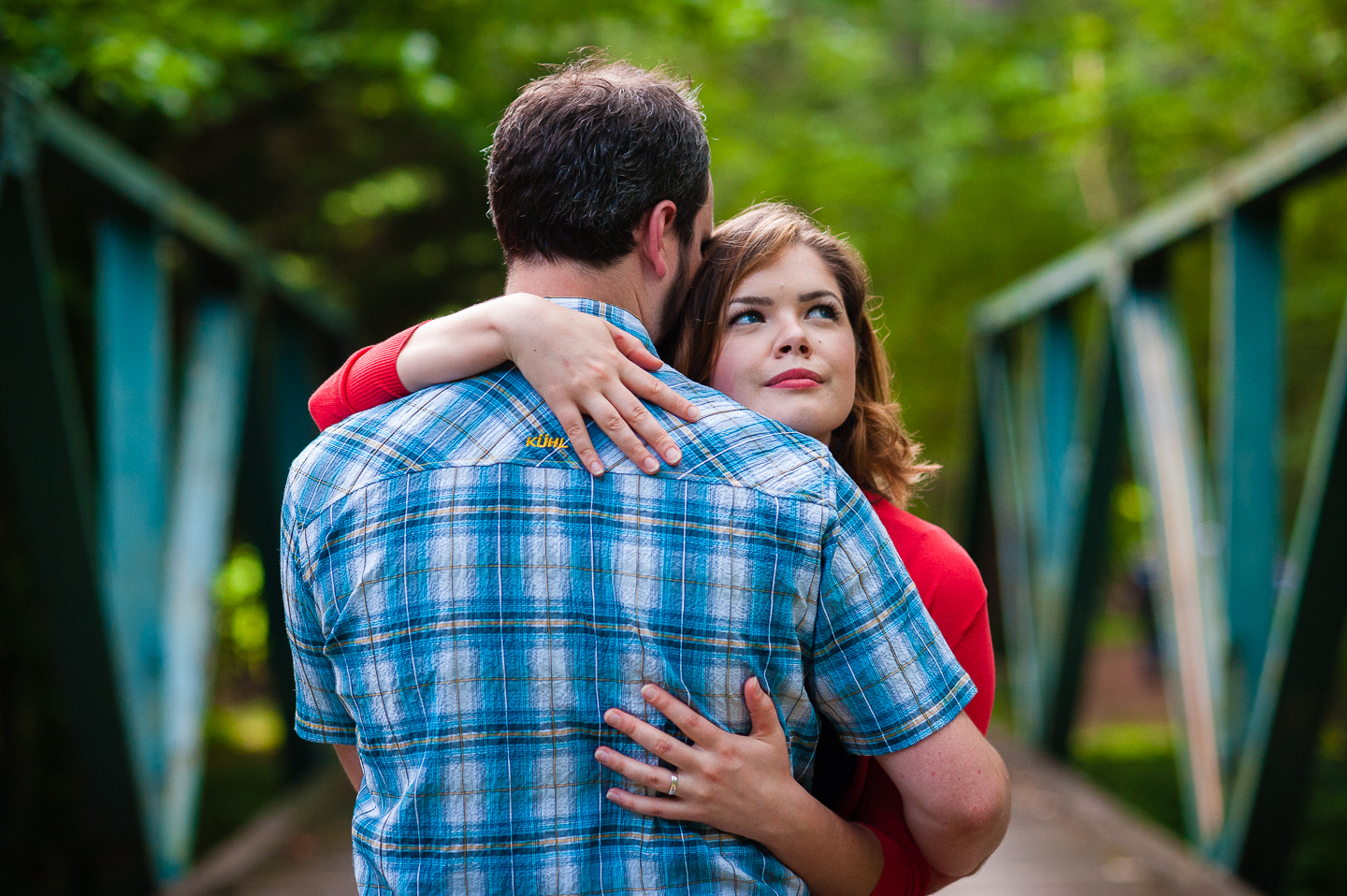 beautiful bride embraces her husband during backyard wedding portraits