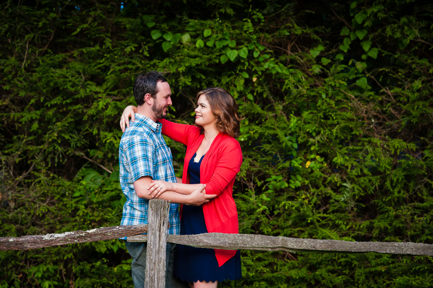 gorgeous young couple steal a glance at each other during their wedding portraits