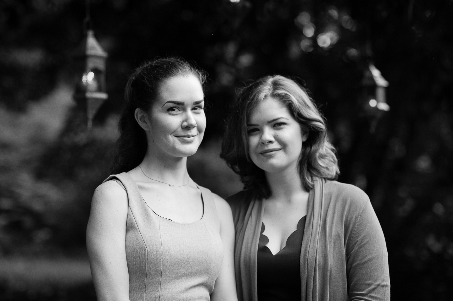 bride and her sister pose for a quick sibling portrait