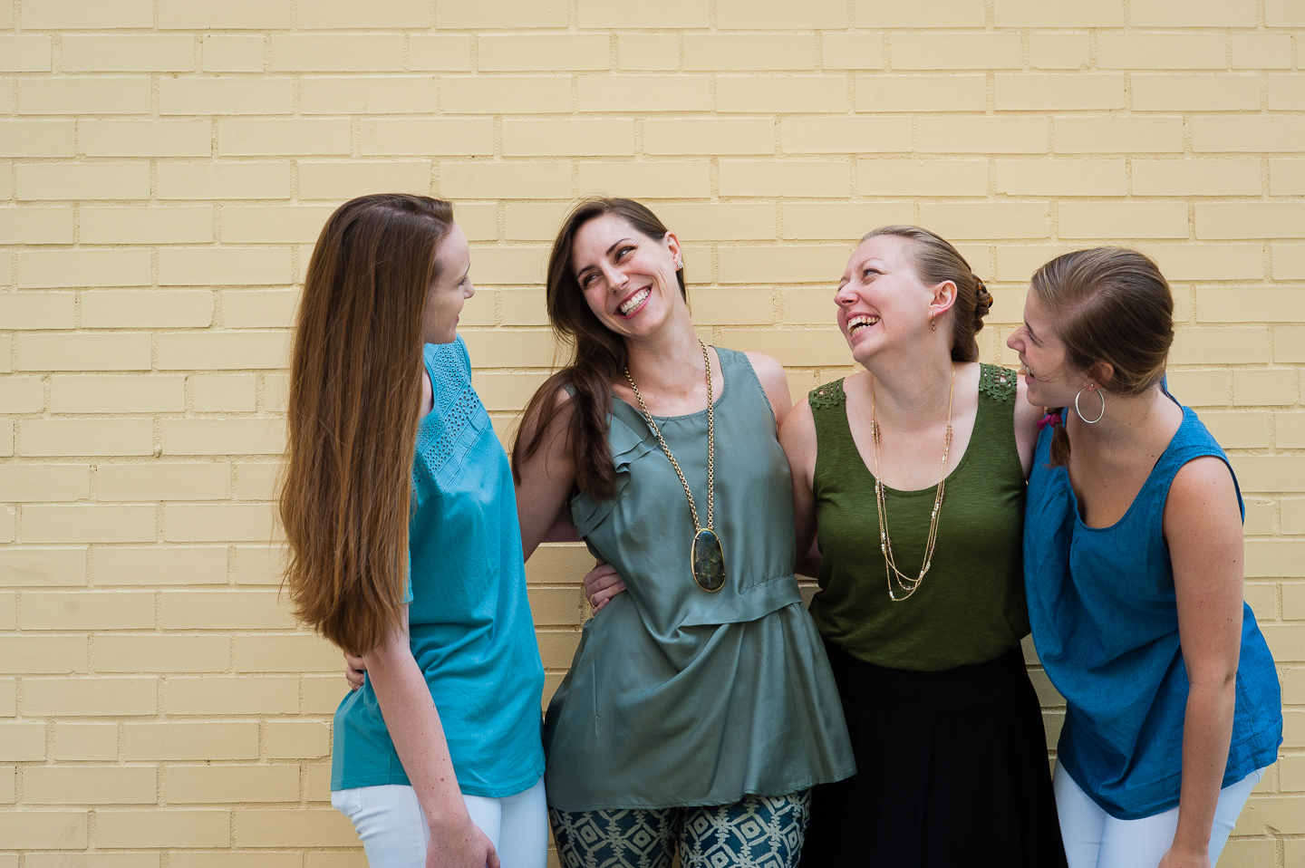 four ladies who are part of I Do wedding planning pose for a picture