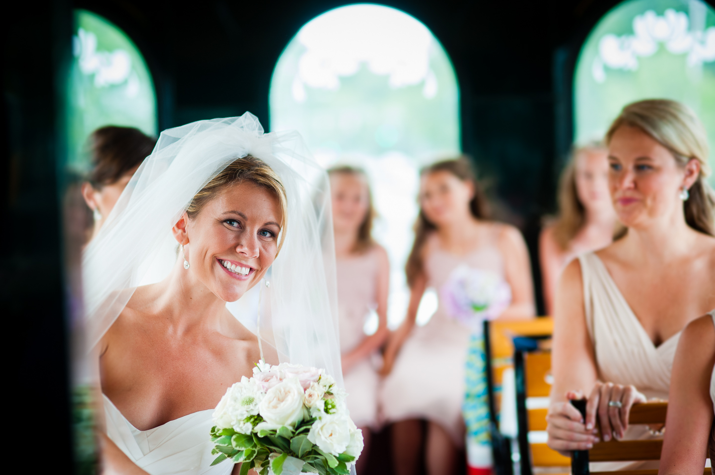 beautiful brides is all smiles during the trolley ride to her wedding ceremony