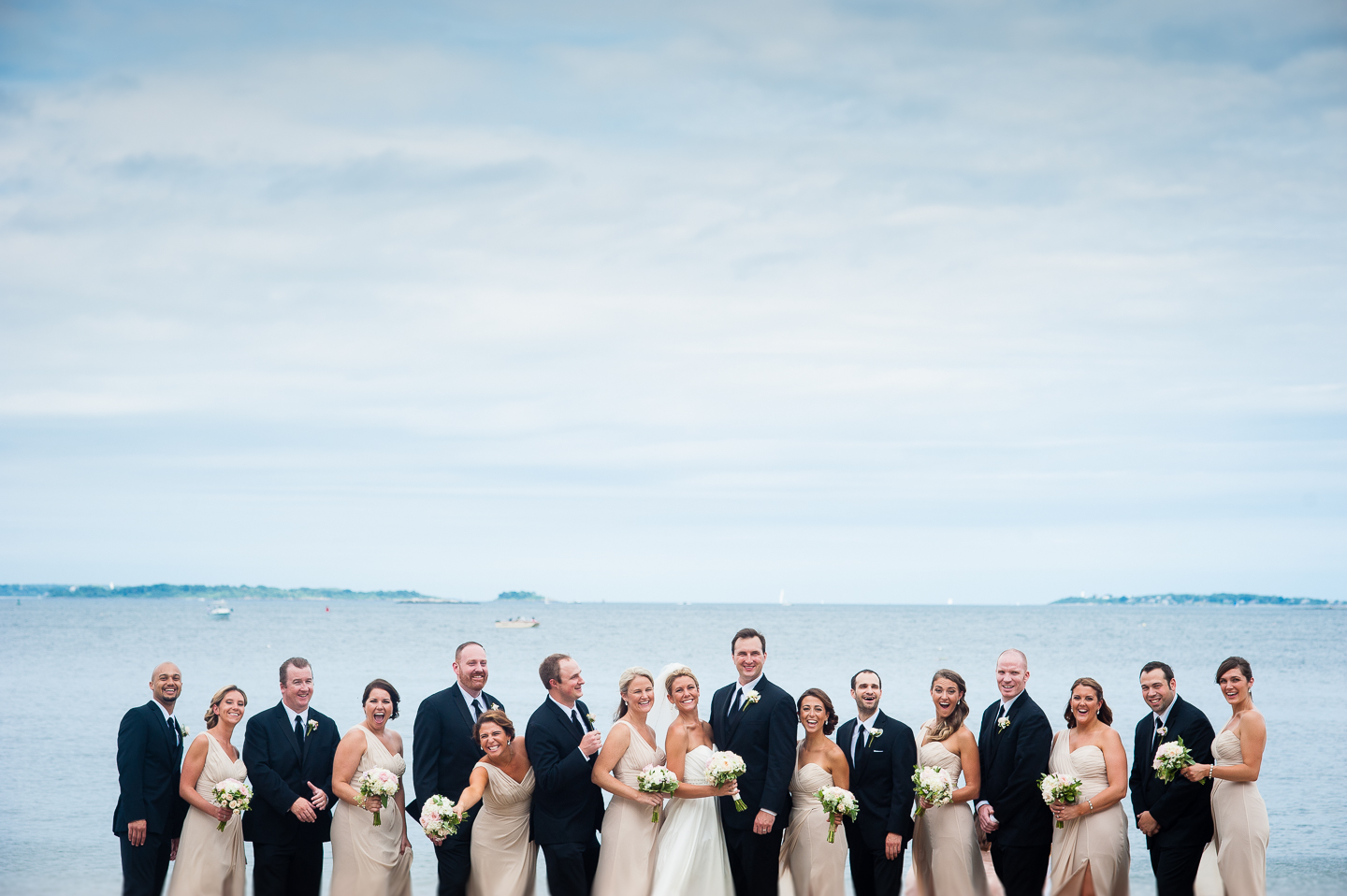 the gorgeous wedding party laughs  for this informal wedding party photo 