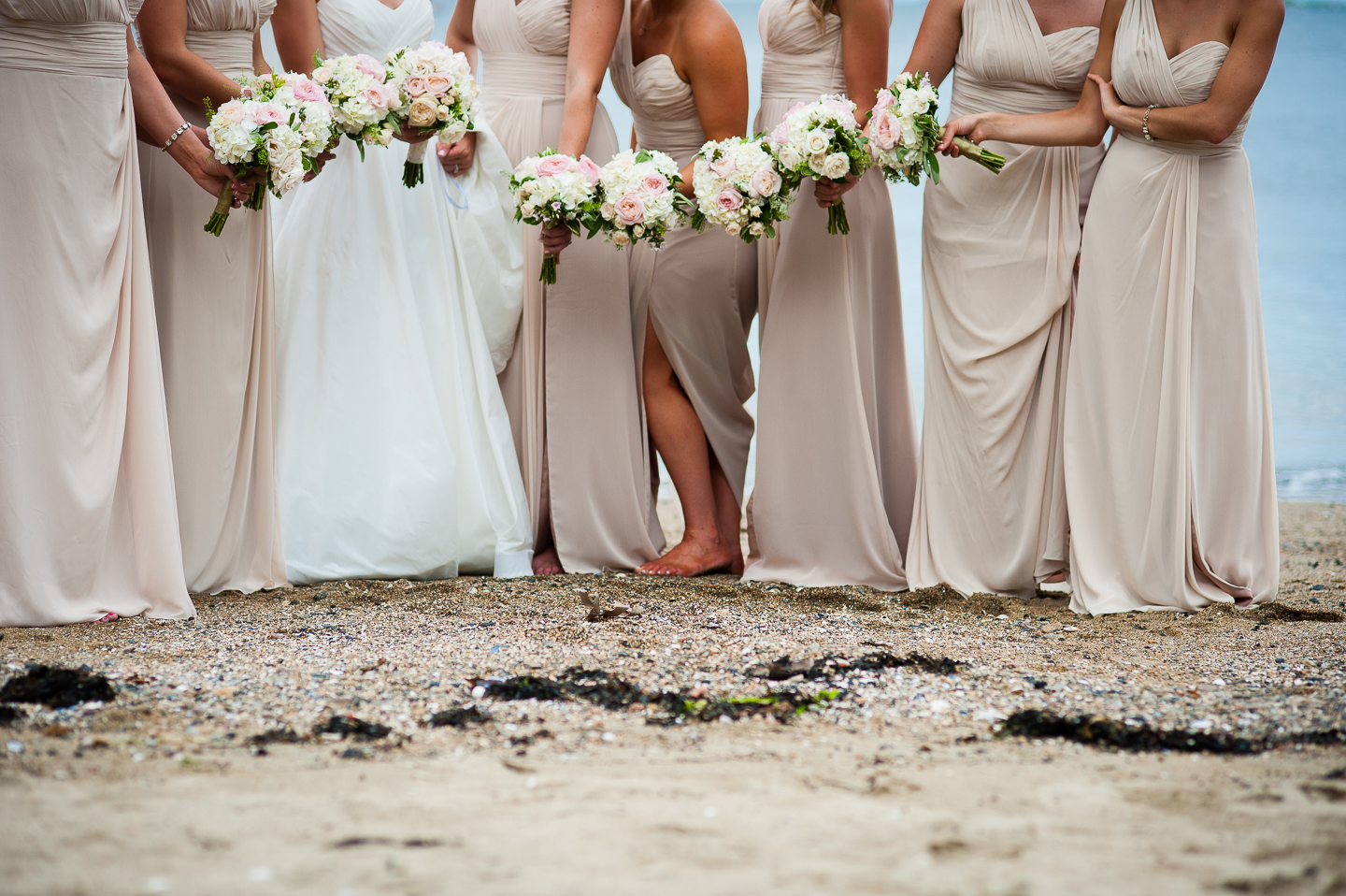 the ladies show off their gorgeous bouquets for this oceanside detail photo 