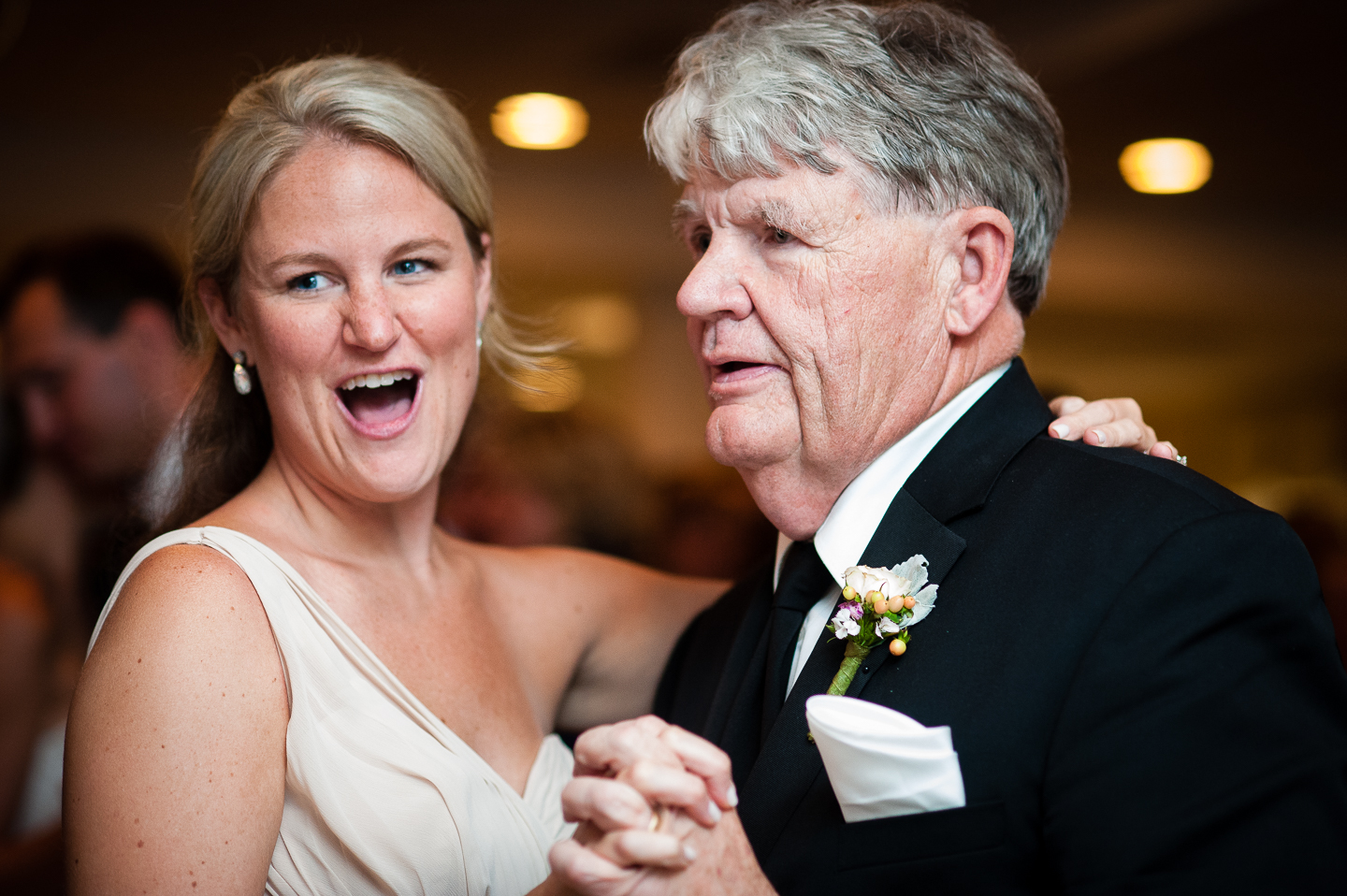 wedding guests dancing during a ballroom wedding reception 