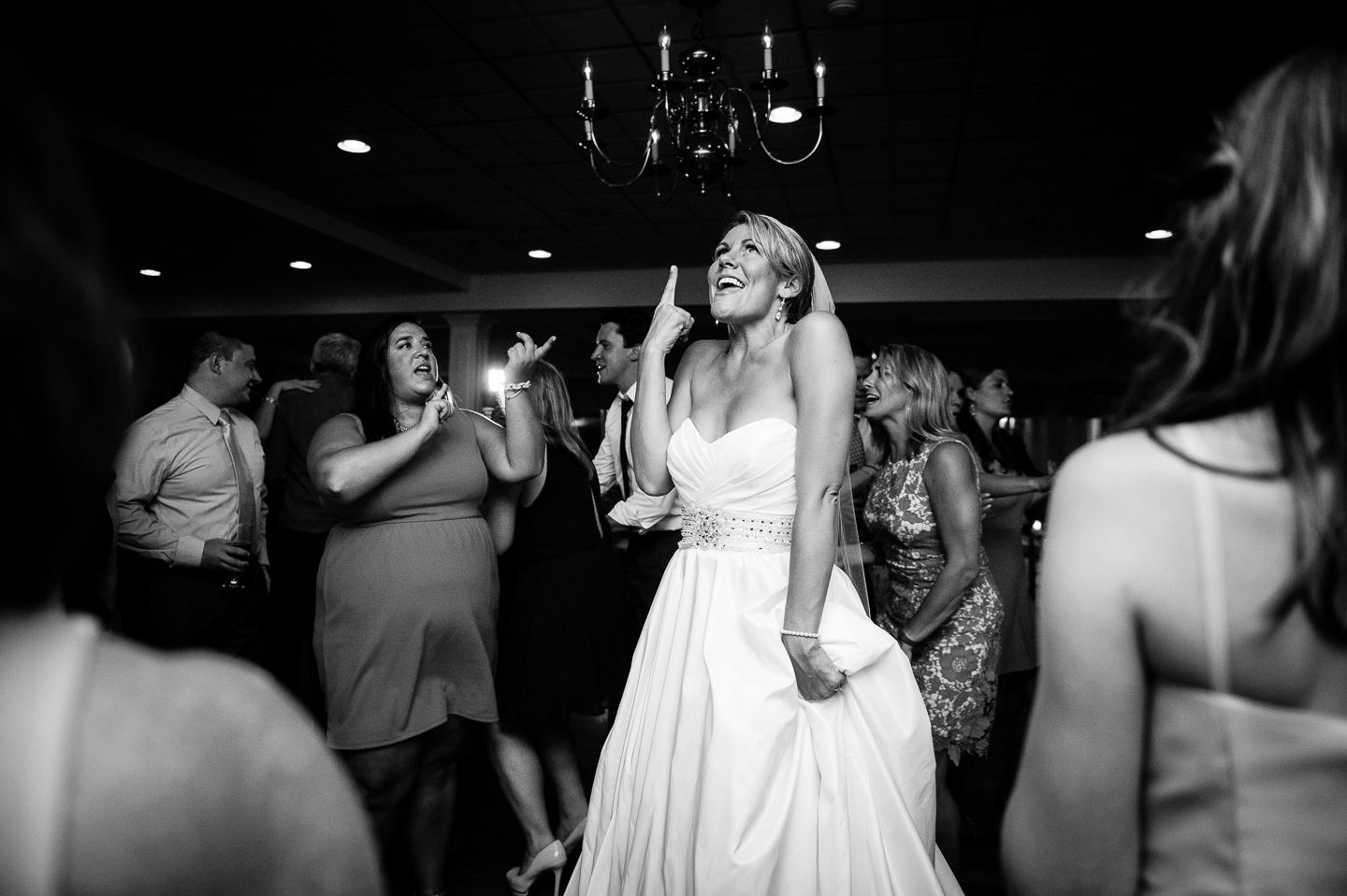 a bride dancing during her evening wedding reception  