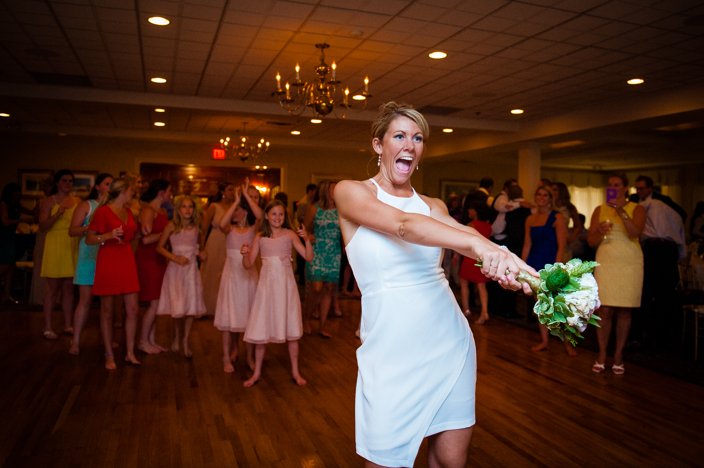 brides prepares to throw her bouquet 