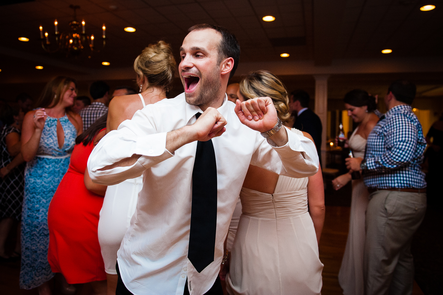 a wedding guest showing off his dance moves 