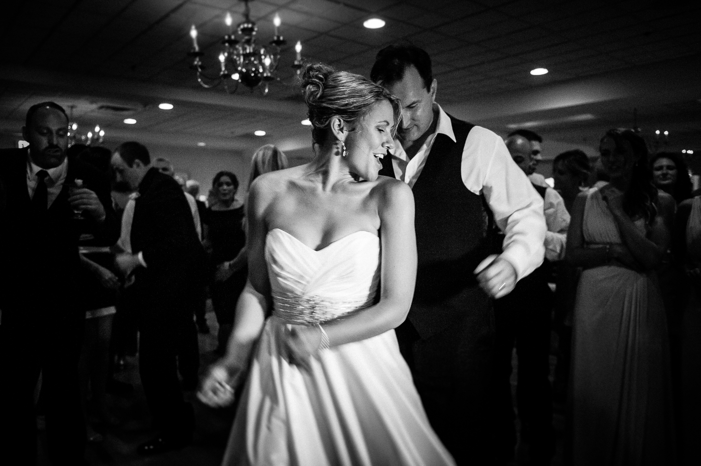 bride and groom dancing at the end of their summer wedding reception 