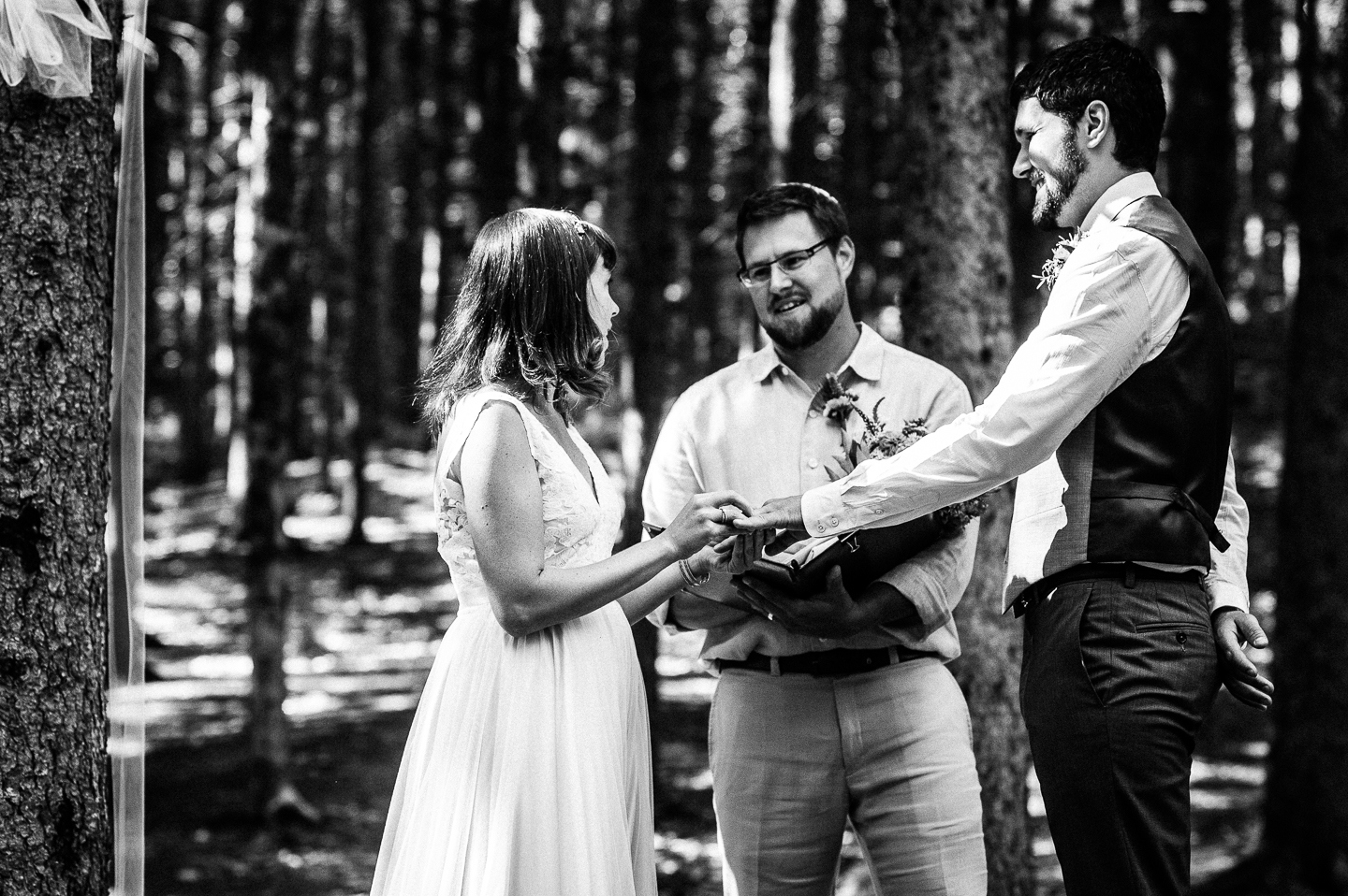 the adorable bride and groom exchange wedding rings