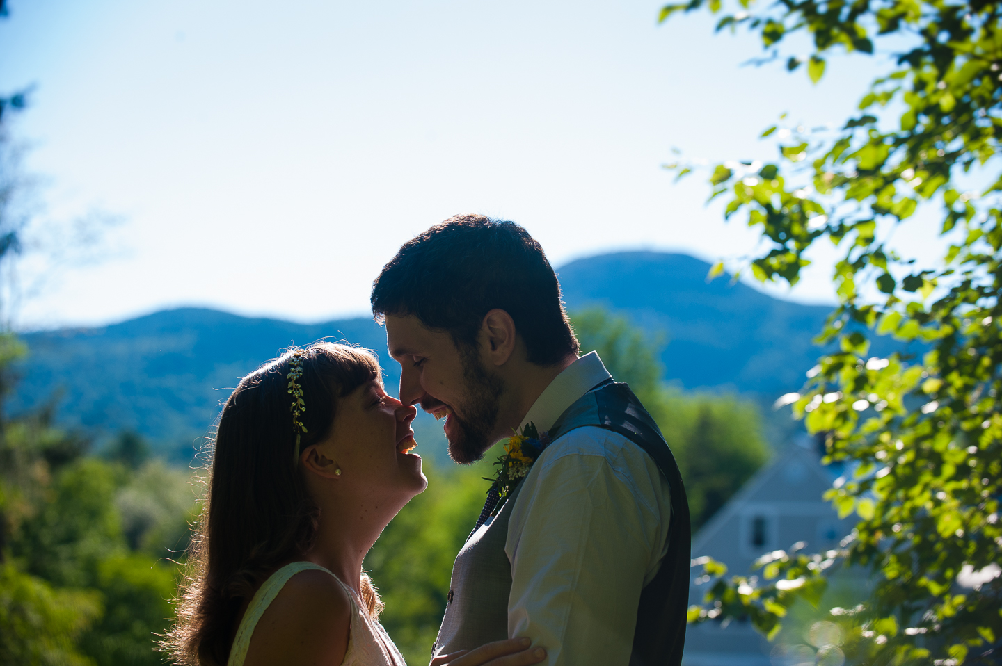 Couple embracing with cardigan mountain in the background