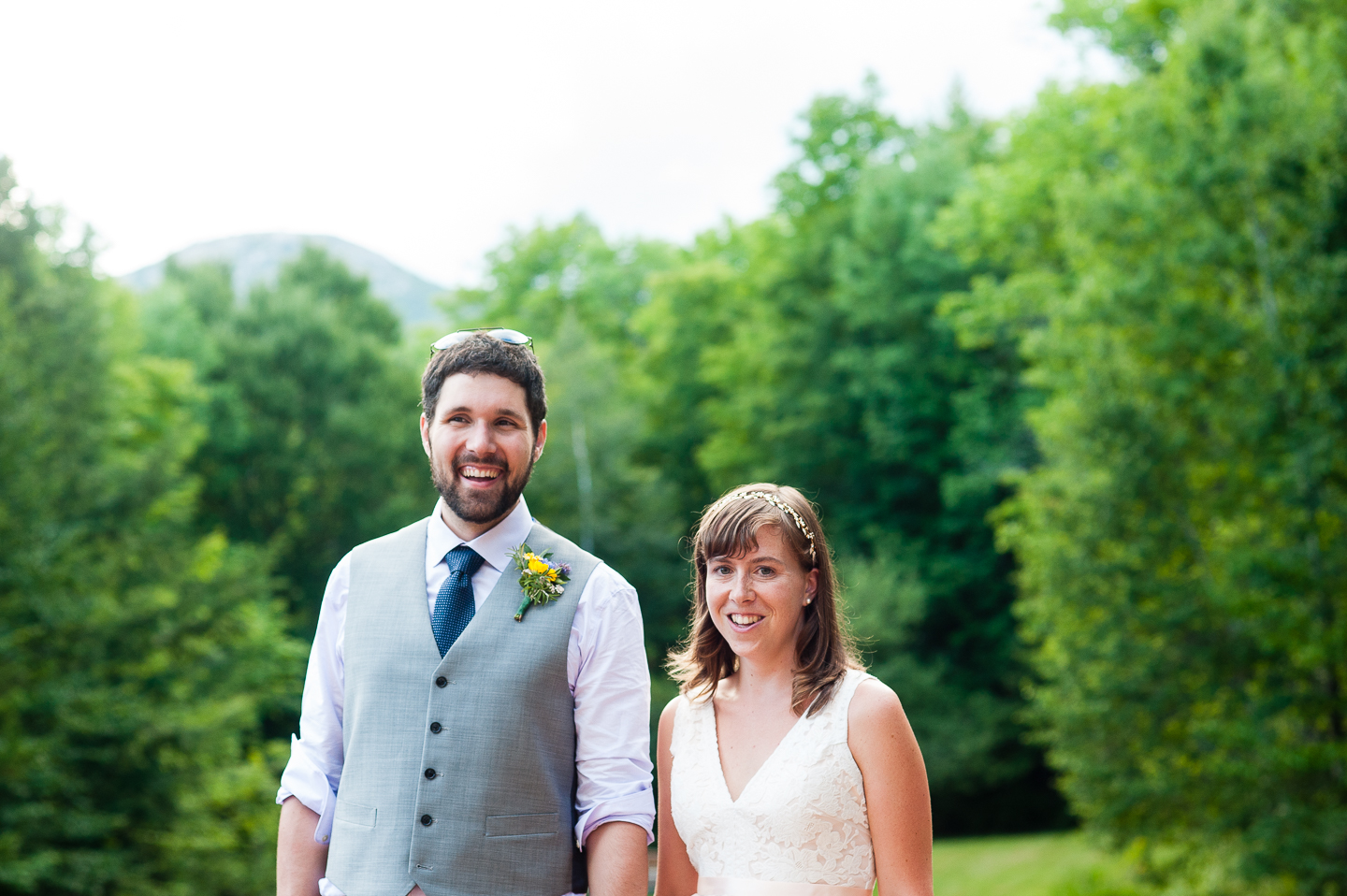 Bride and Groom smiling at the camera