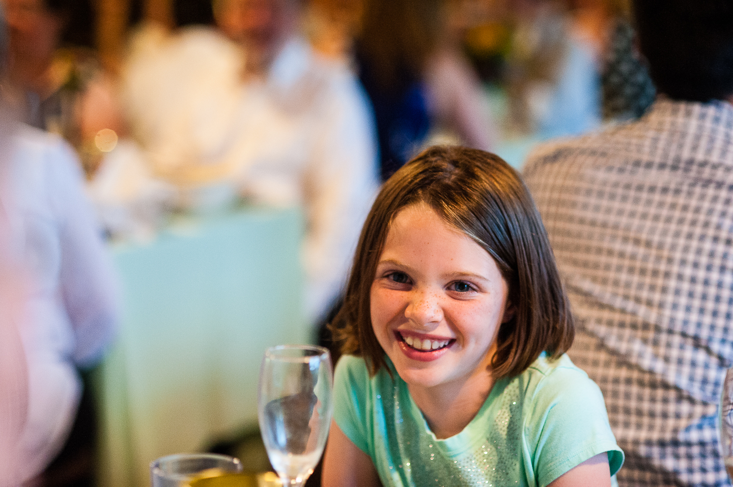 adorable little wedding guest smiling for camera