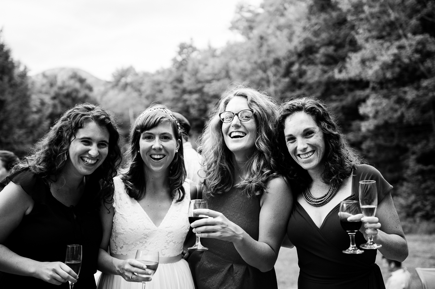 pretty bride and some close friends laughing for a quick photo