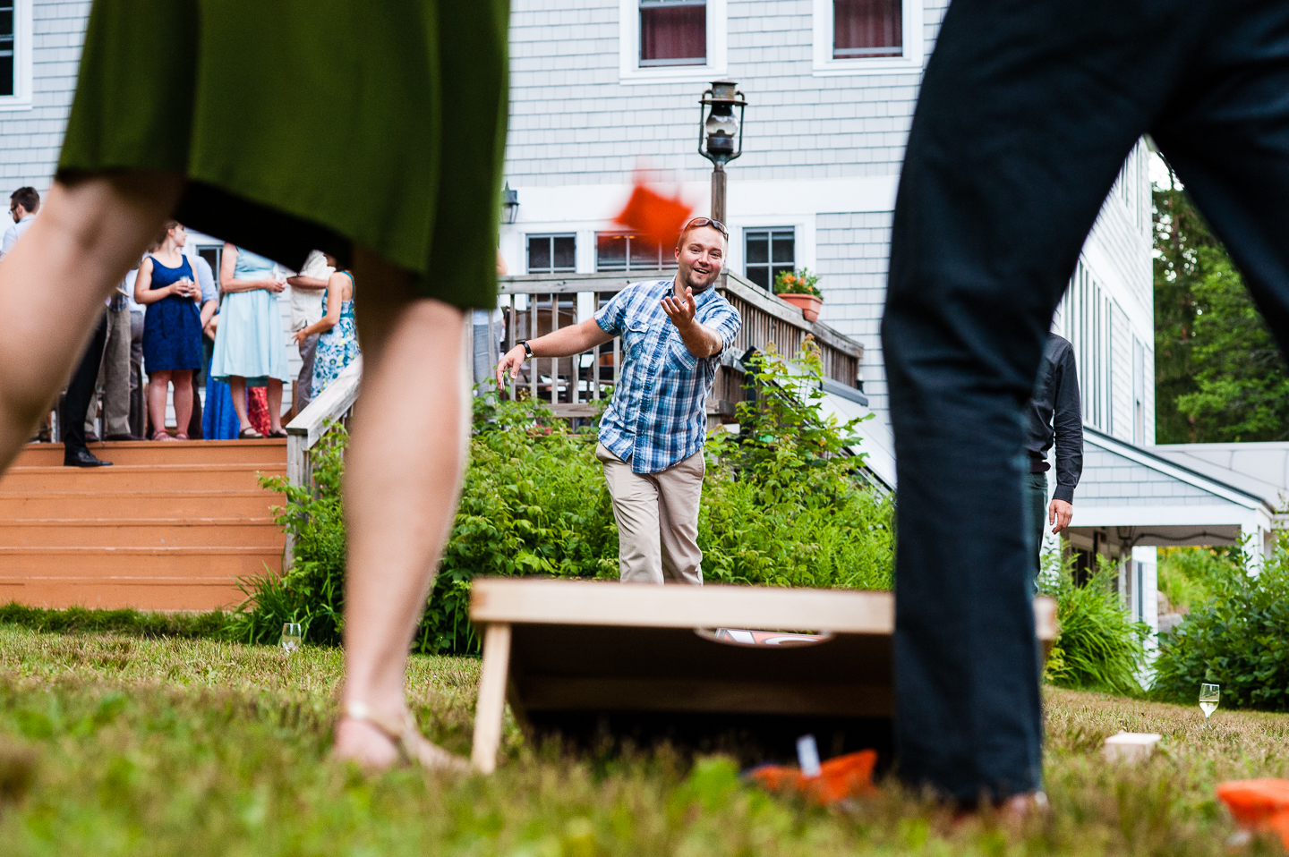 wedding guests played lawn games during this mountain lodge wedding