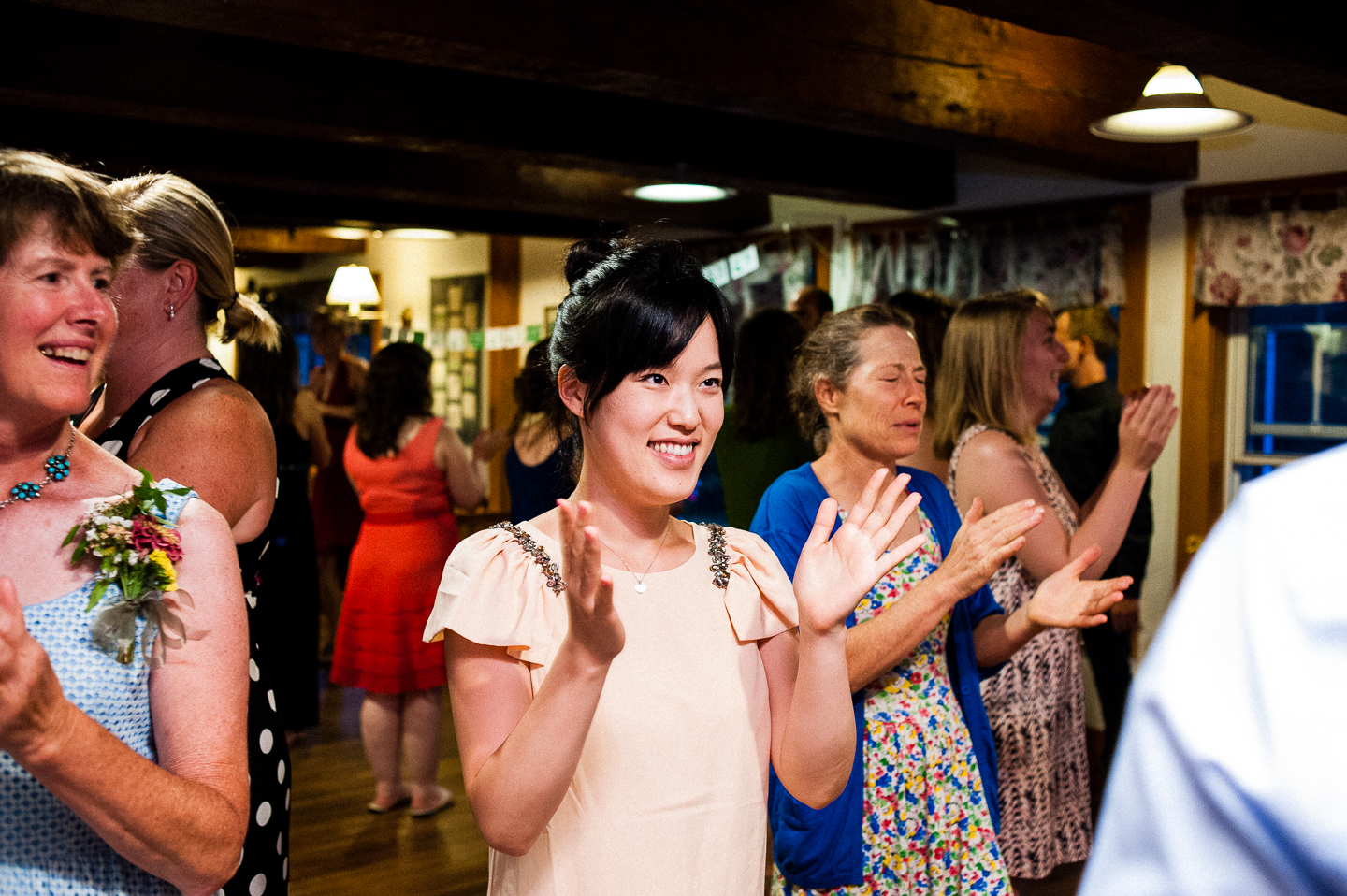 a wedding guests enjoys some contra dancing during this rustic wedding reception