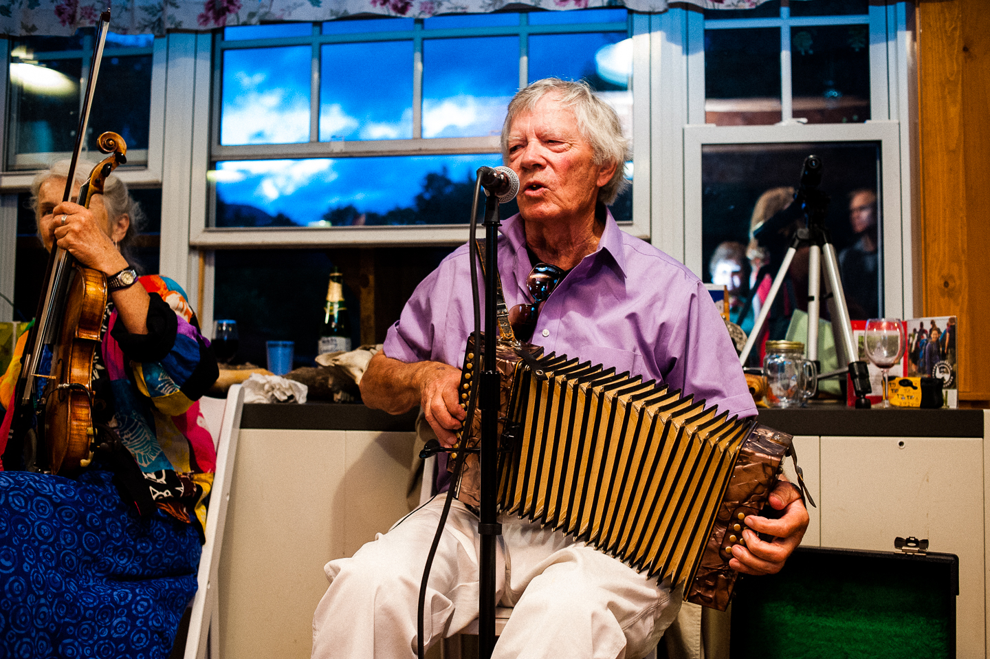 live musicians play countra dancing music during this rustic wedding reception