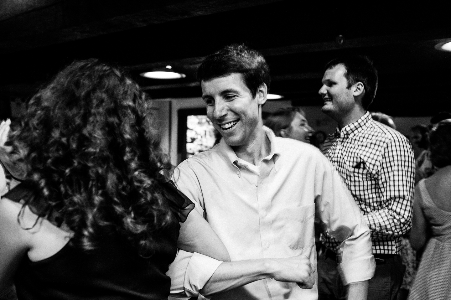 wedding guests having fun contra dancing 