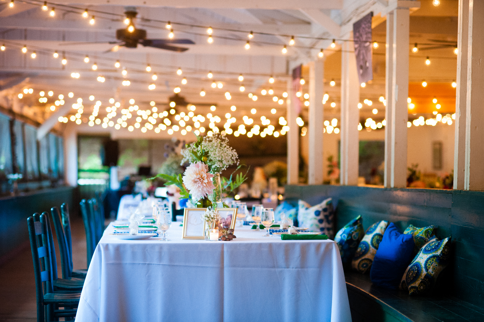 beautiful rustic summer camp reception with twinkly lights 