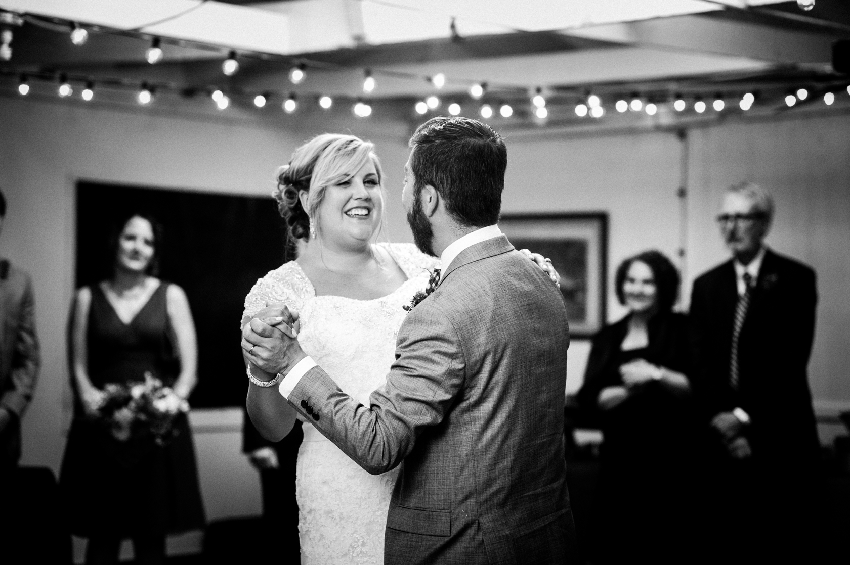 bride smiling from ear to ear during their first dance 