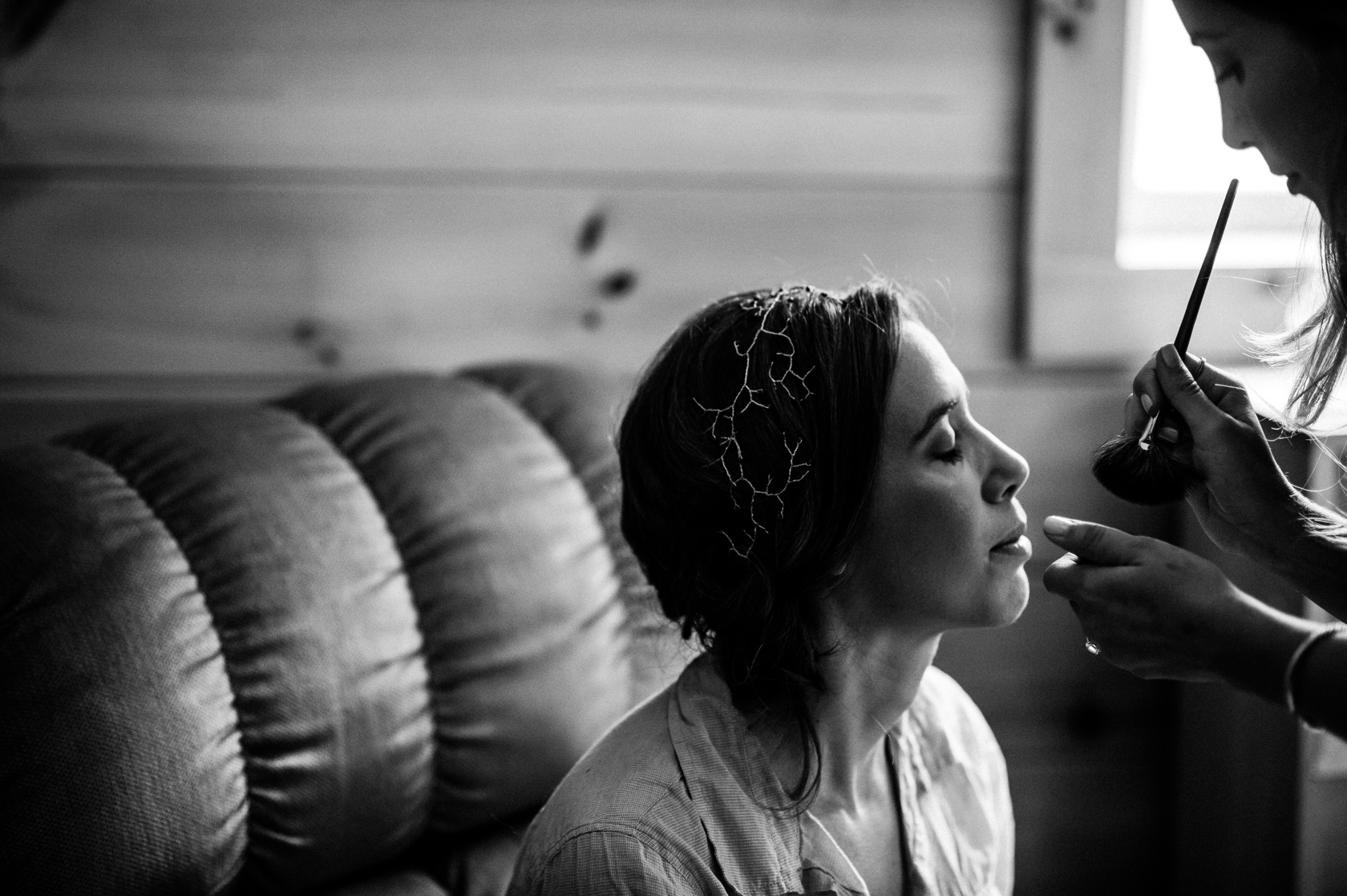 beautiful bride getting her makeup done