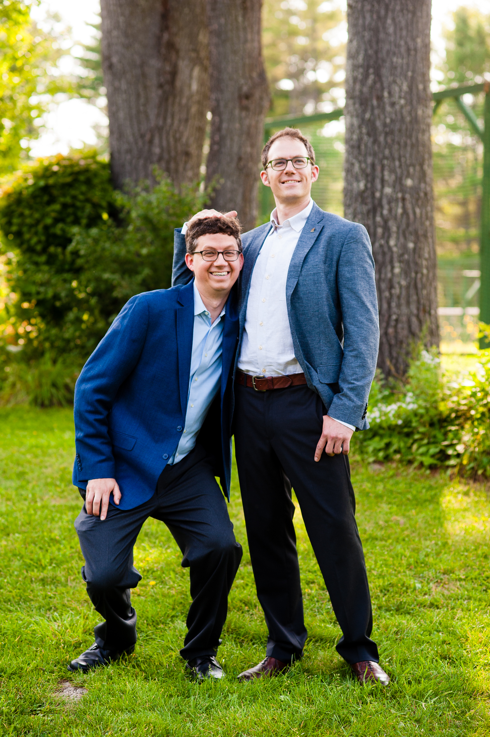 groom and his best man goof off for a quick picture